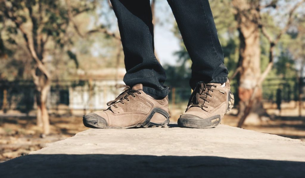 Crafting Captivating Headlines: Your awesome post title goes here Close-up of brown casual shoes worn outdoors on a sunny day, capturing a lifestyle scene.